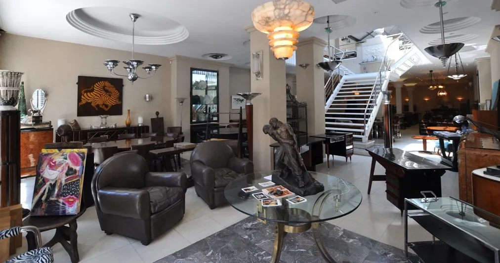 Two antique hanging lamps in an elegant setting with furniture