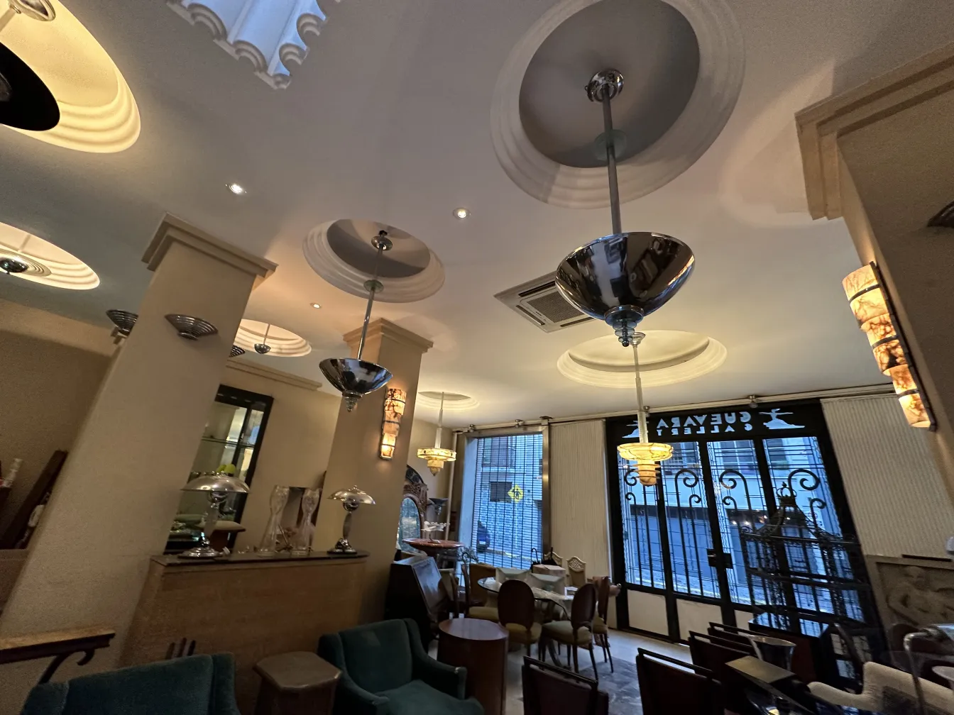 Two antique hanging lamps in an elegant setting.