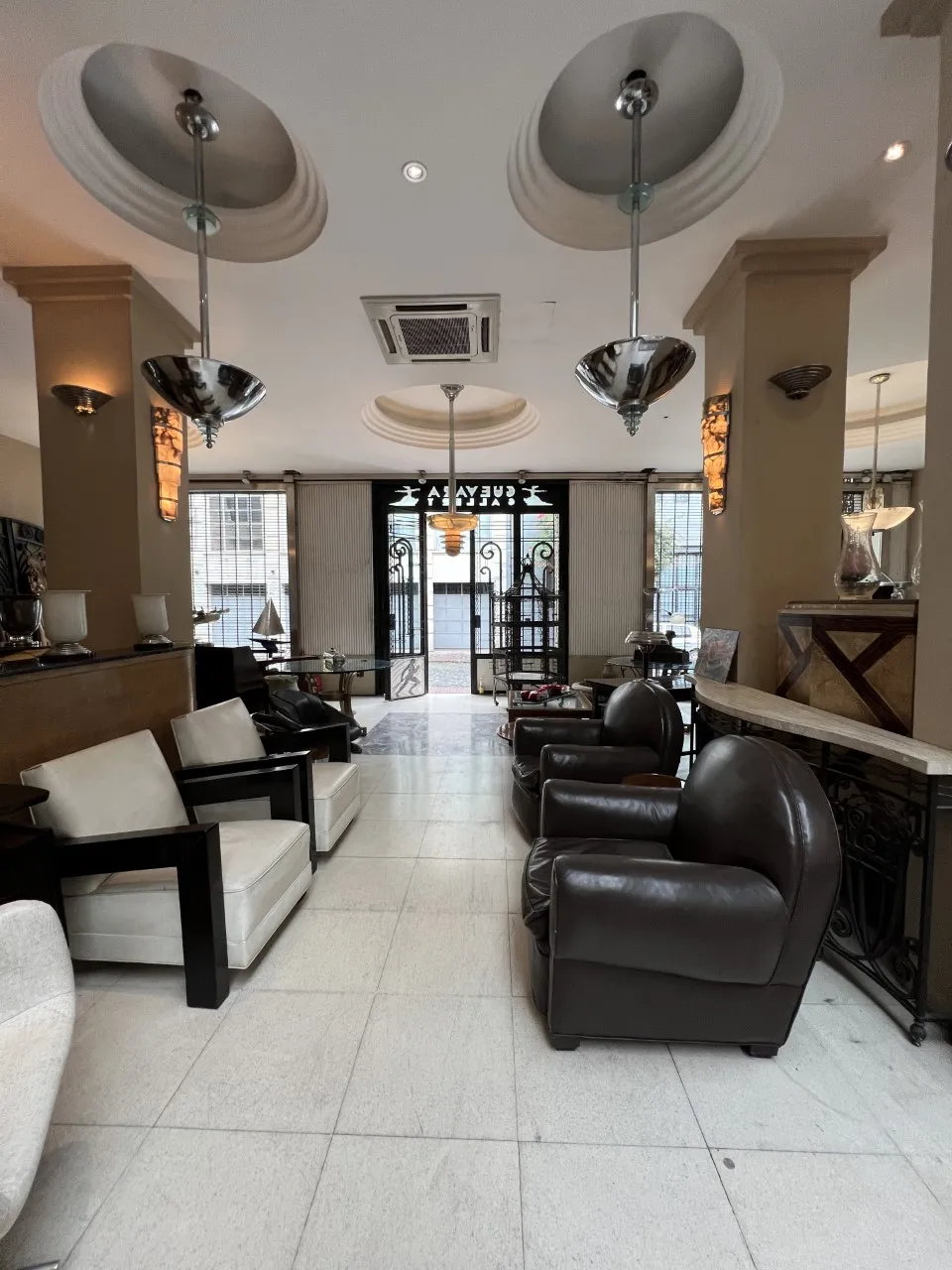 two antique hanging lamps in an elegant environment