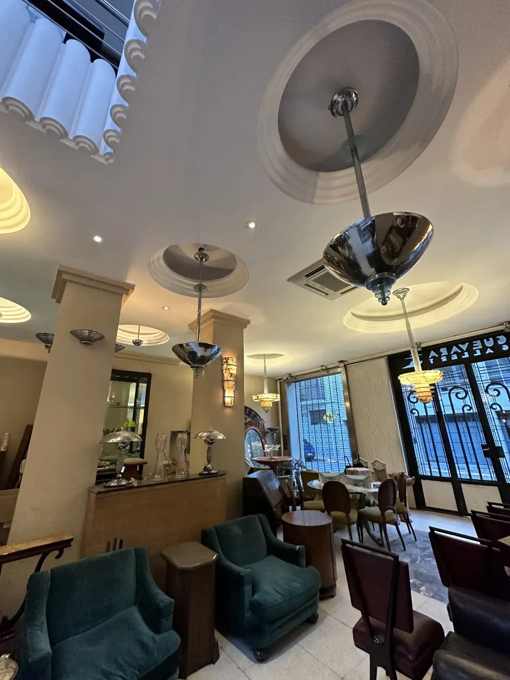 two antique hanging lamps in a cozy restaurant