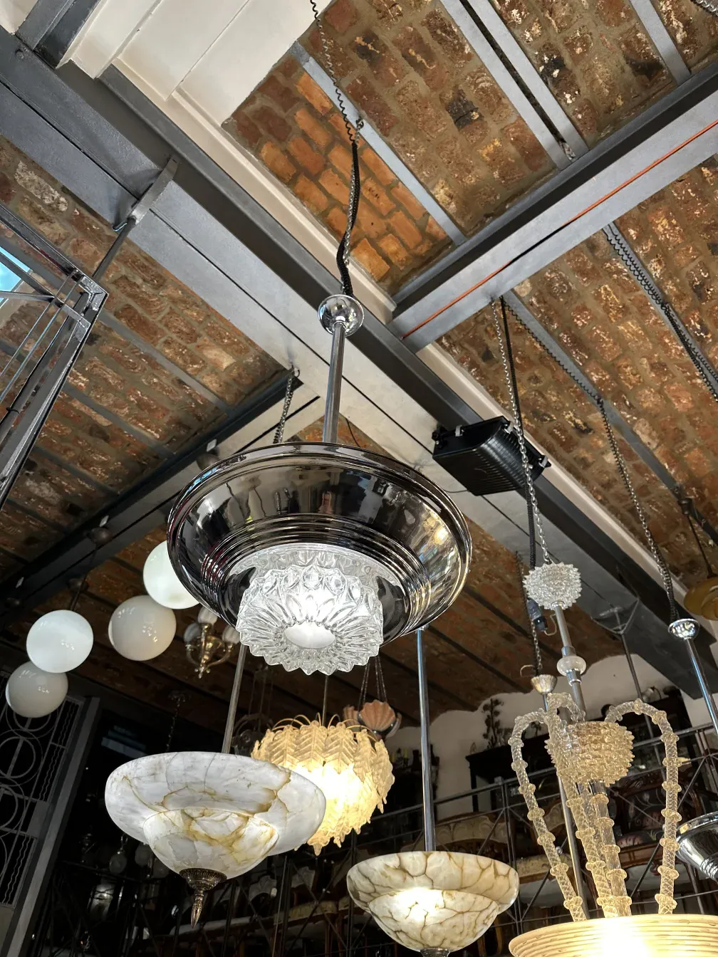 Two antique hanging lamps, showcasing varied designs in a cozy setting
