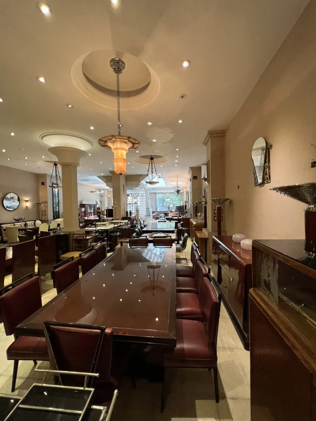 View of two antique hanging lamps in an elegant restaurant setting.