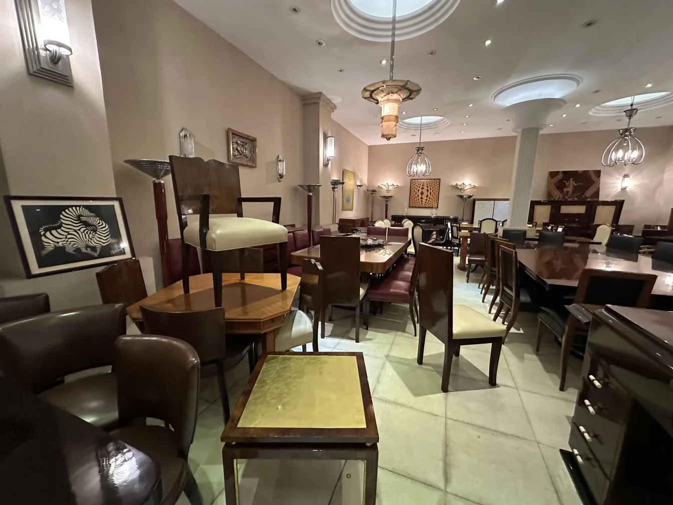 two antique hanging lamps in an elegant setting with various furniture