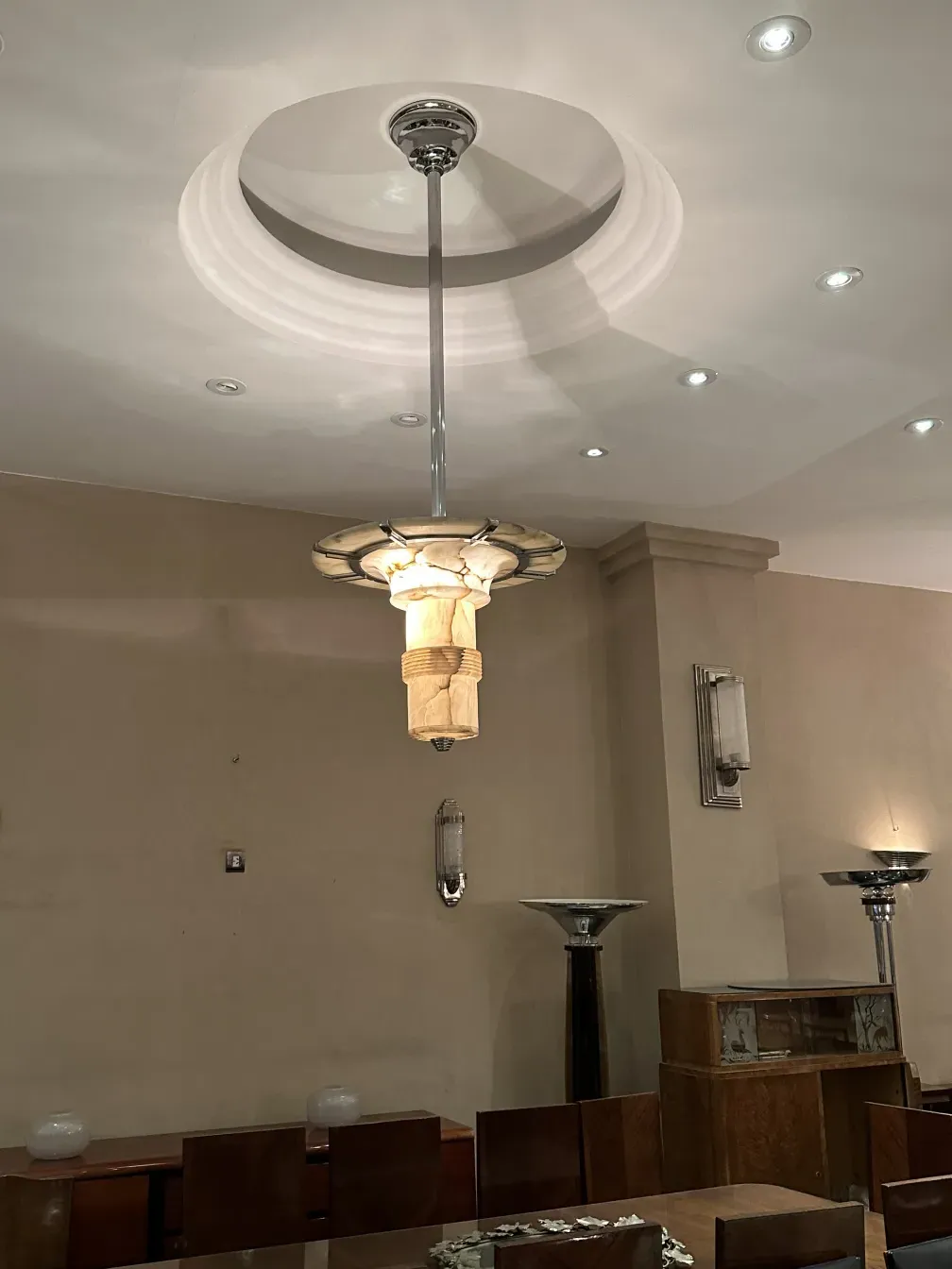 two antique hanging lamps glowing in a warm setting