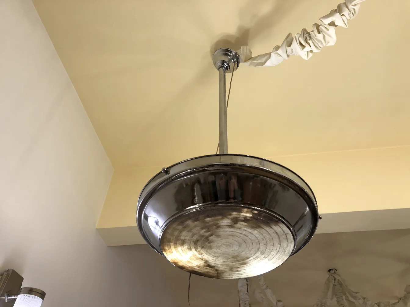 two antique hanging lamps suspended in a warm setting