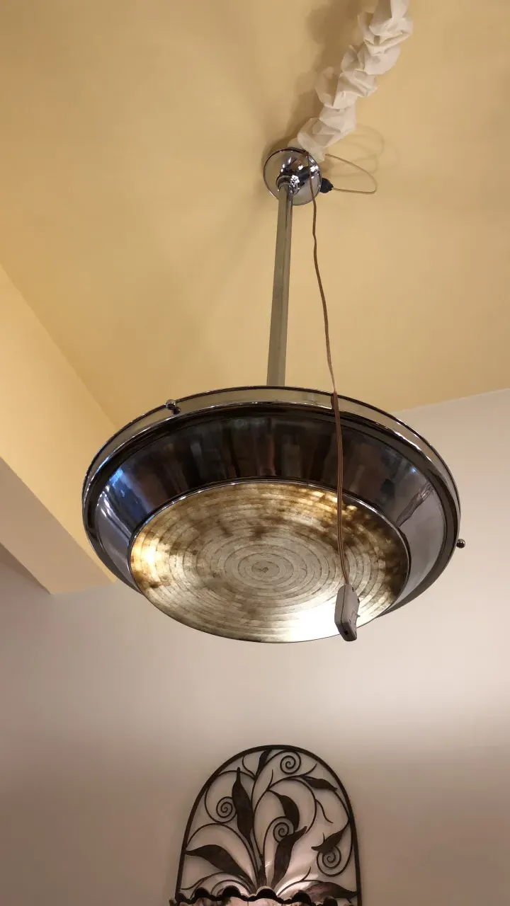 2 antique hanging lamps with a unique and attractive design, illuminating a modern space