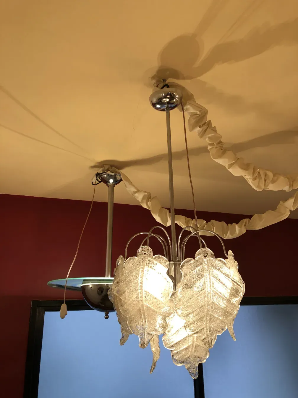 Two antique hanging lamps with elegant design illuminating a cozy space