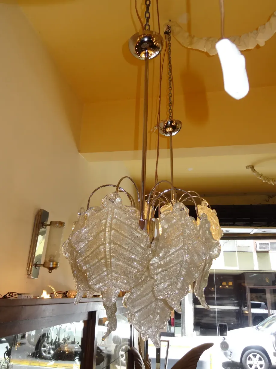 two antique hanging lamps with decorative design in light color