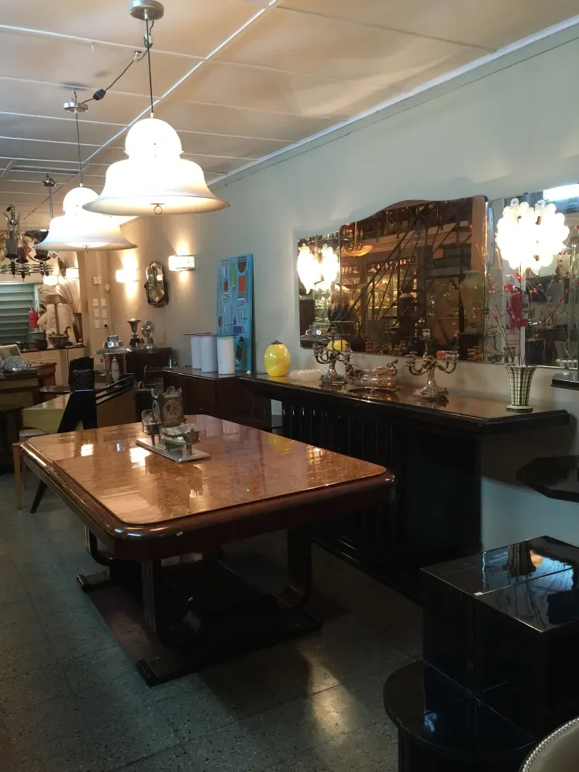 two antique hanging lamps in a warm, lit environment