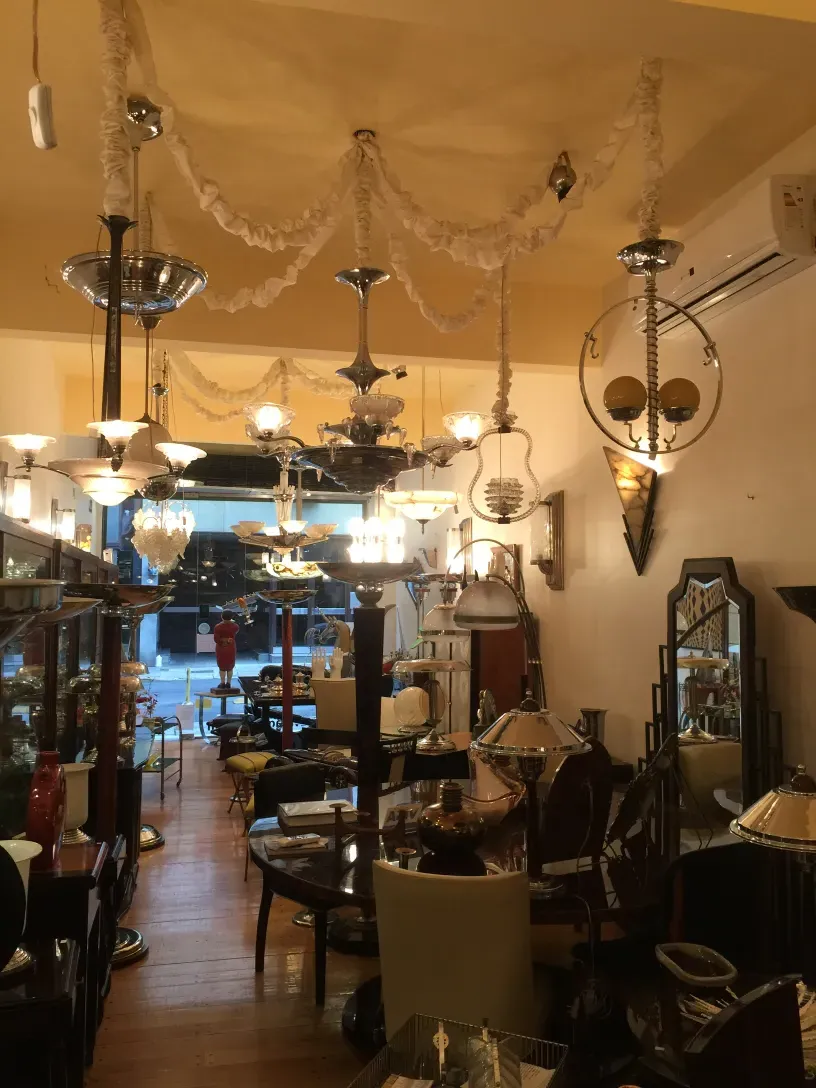 Two antique hanging lamps in a styled room