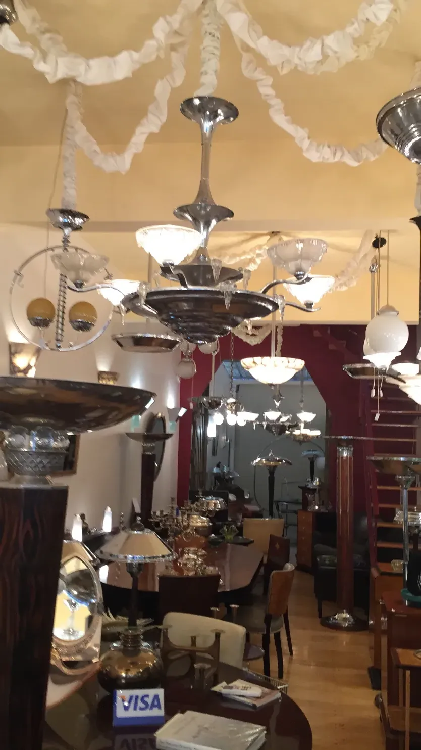 Two antique hanging lamps in a decorative setting