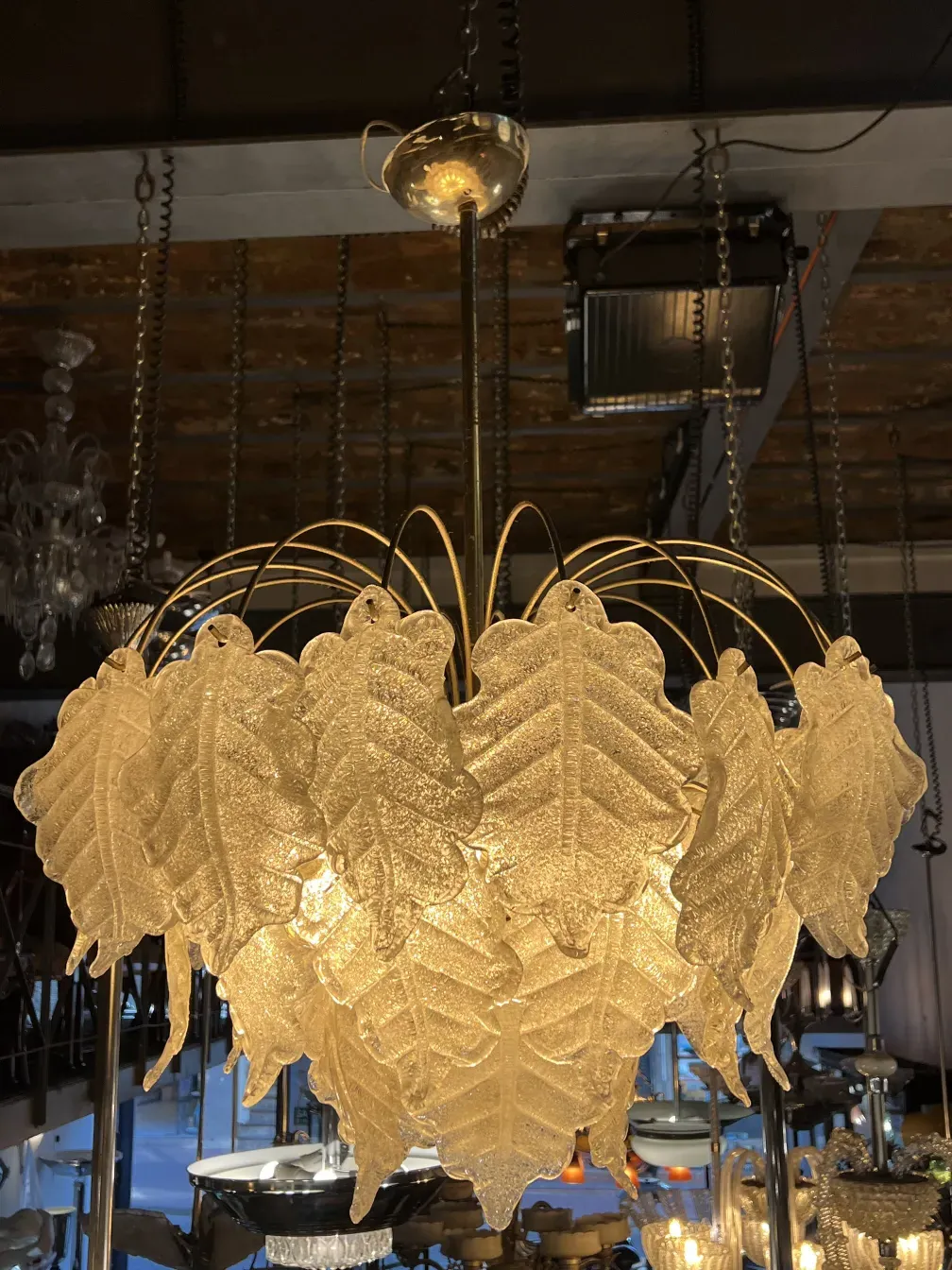 2 antique hanging lamps with leaf design in an elegant setting