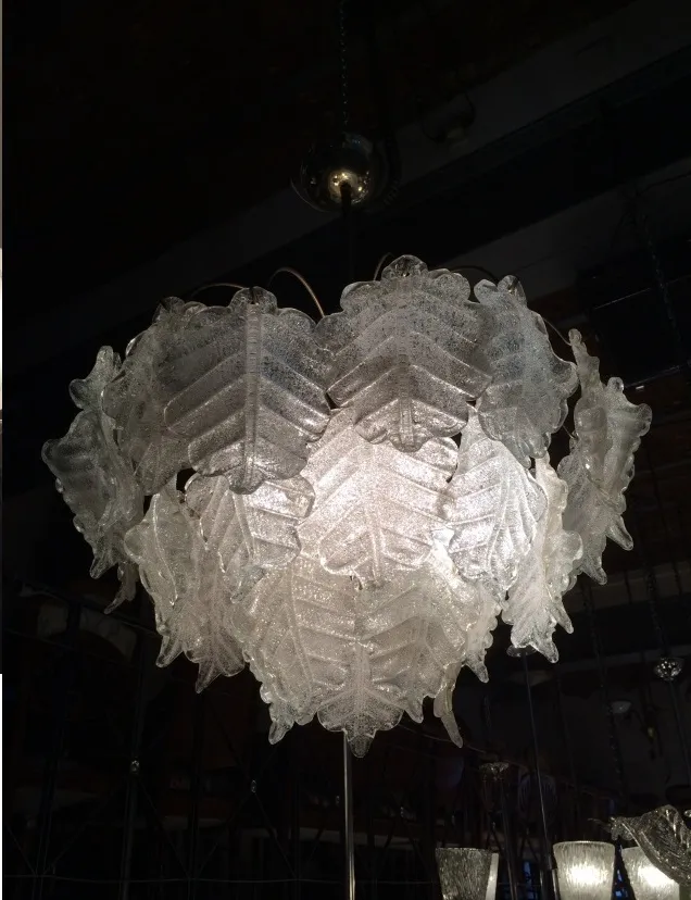 2 antique hanging lamps with beautiful leaf design, illuminating a contemporary setting.