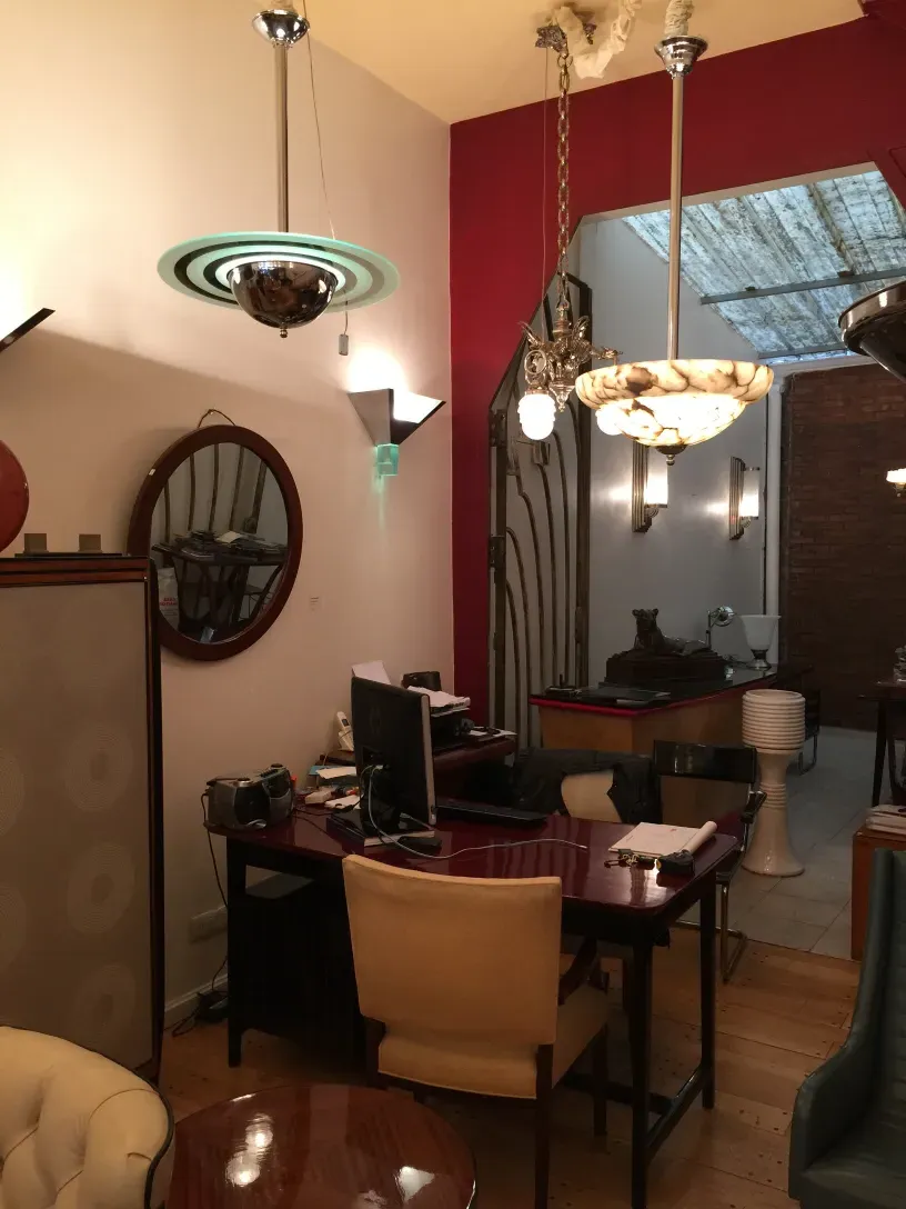 2 antique hanging lamps in an elegant setting with decorative details and an attractive design.