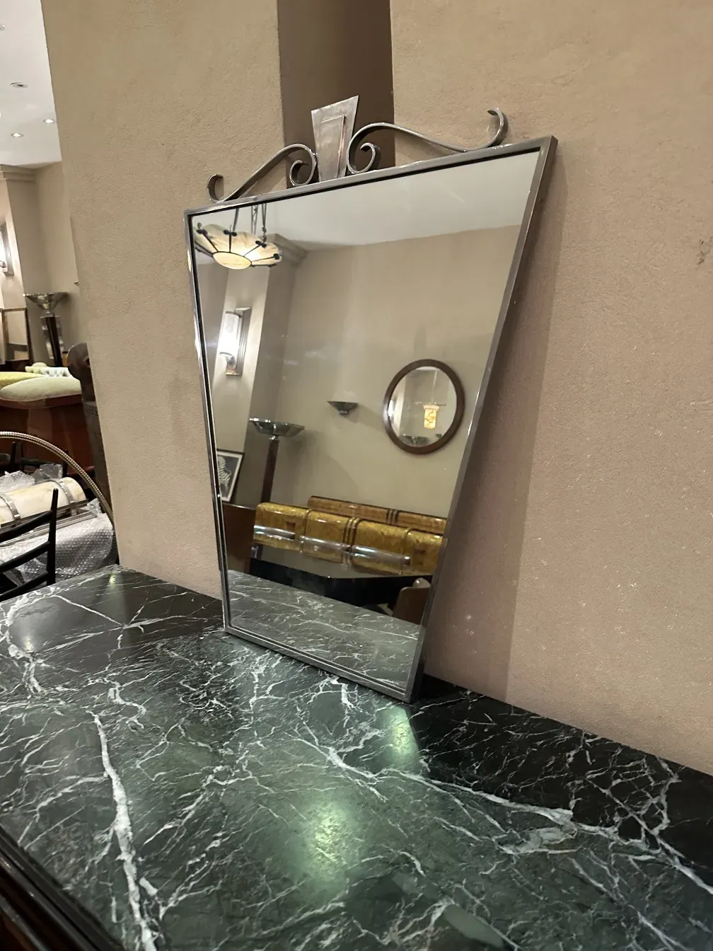 antique mirror with a decorative frame in a classic setting