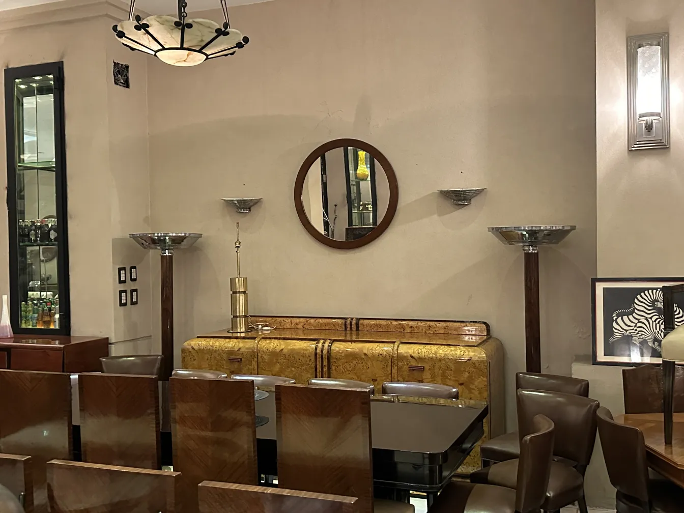 antique round mirror on a wall enhancing elegant decor