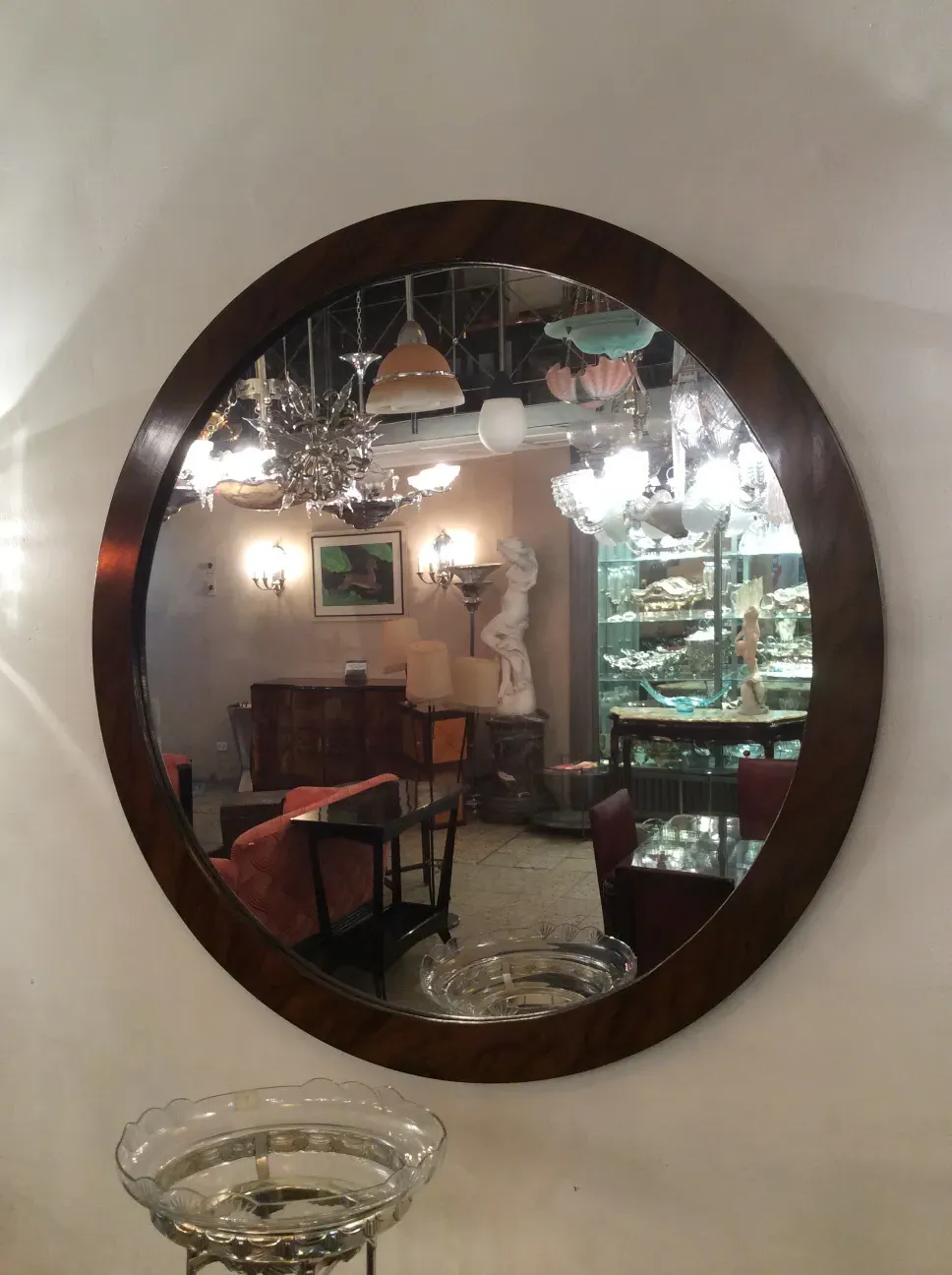 Antique decorative mirror with an elegant frame.