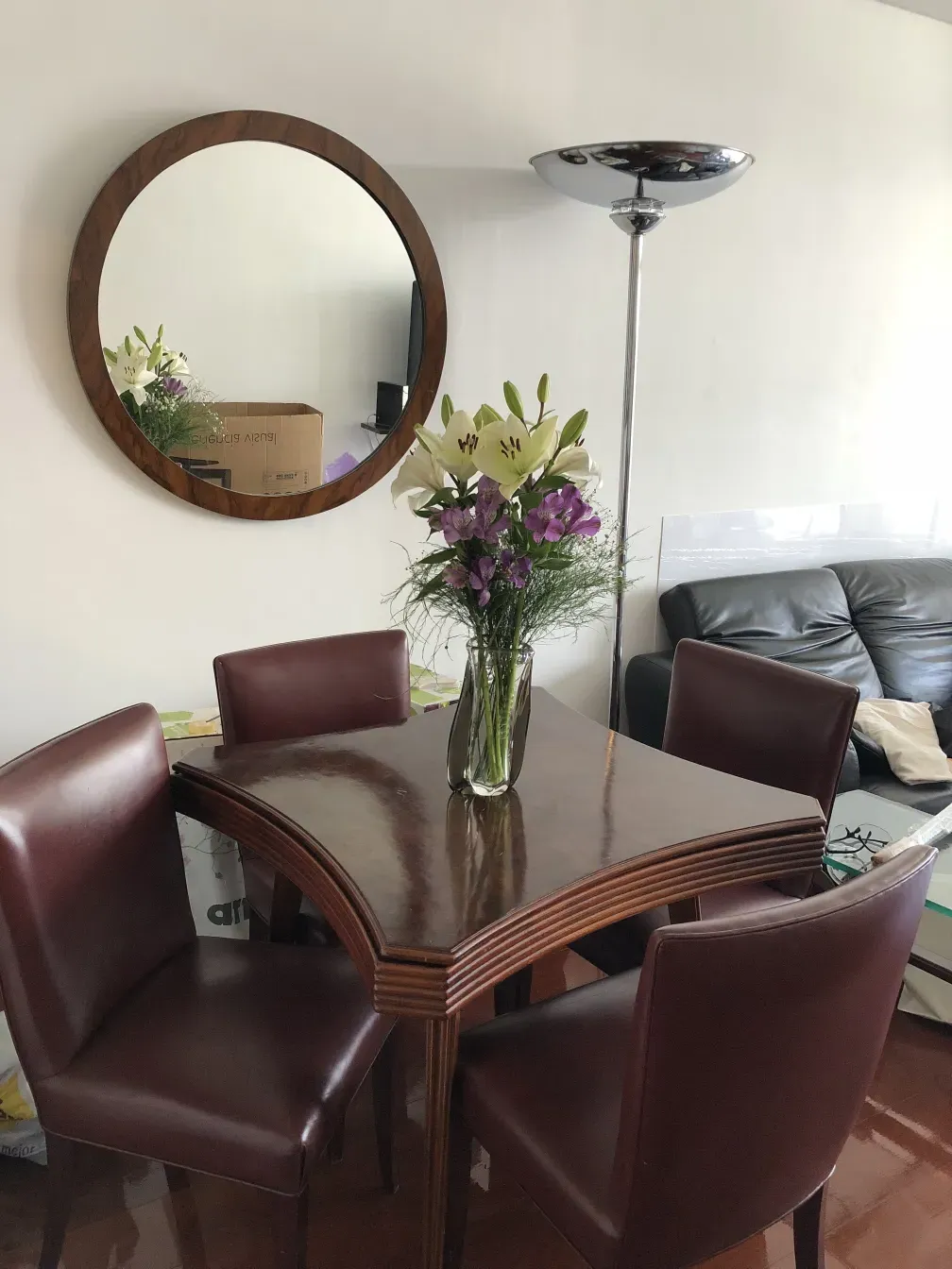 antique round mirror in a modern decor