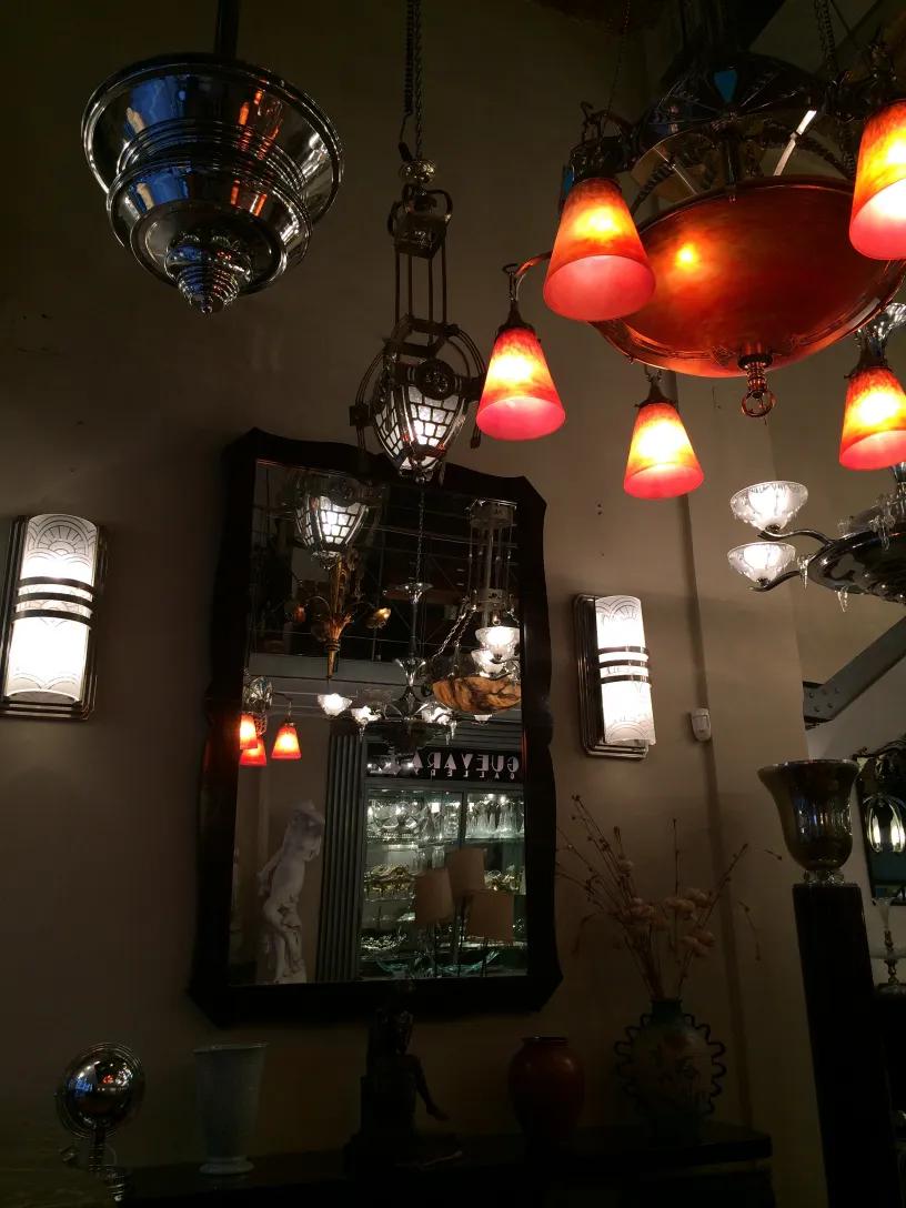 antique decorative mirror in a setting with various lights
