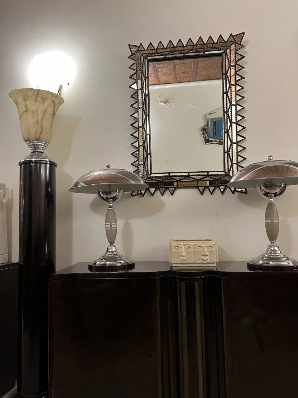antique mirror with decorative frame on the wall