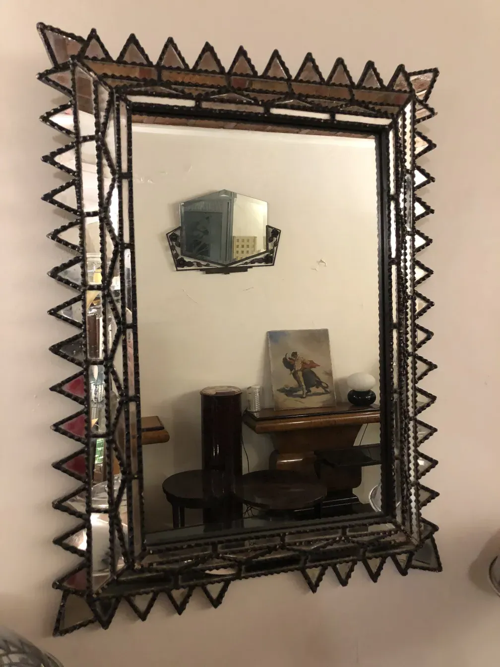 decorative antique mirror with an intricate frame