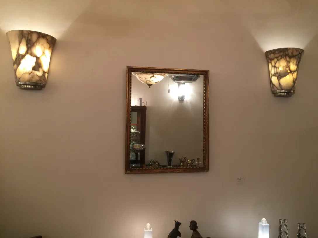 antique mirror framed with classic style lights