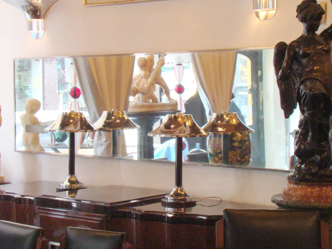 antique mirror with decoration and lamps in the scene