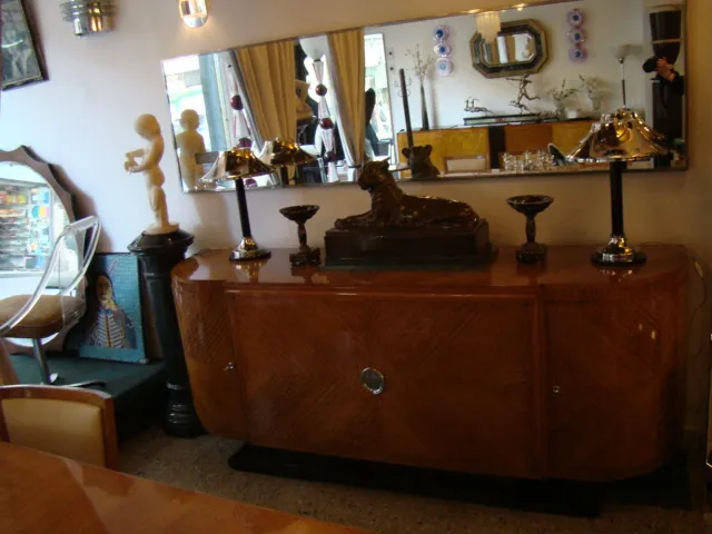 Antique decorative mirror with an elegant frame in a modern setting.