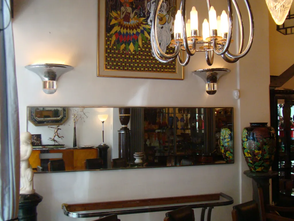 antique mirror on a wall with soft decorative lighting