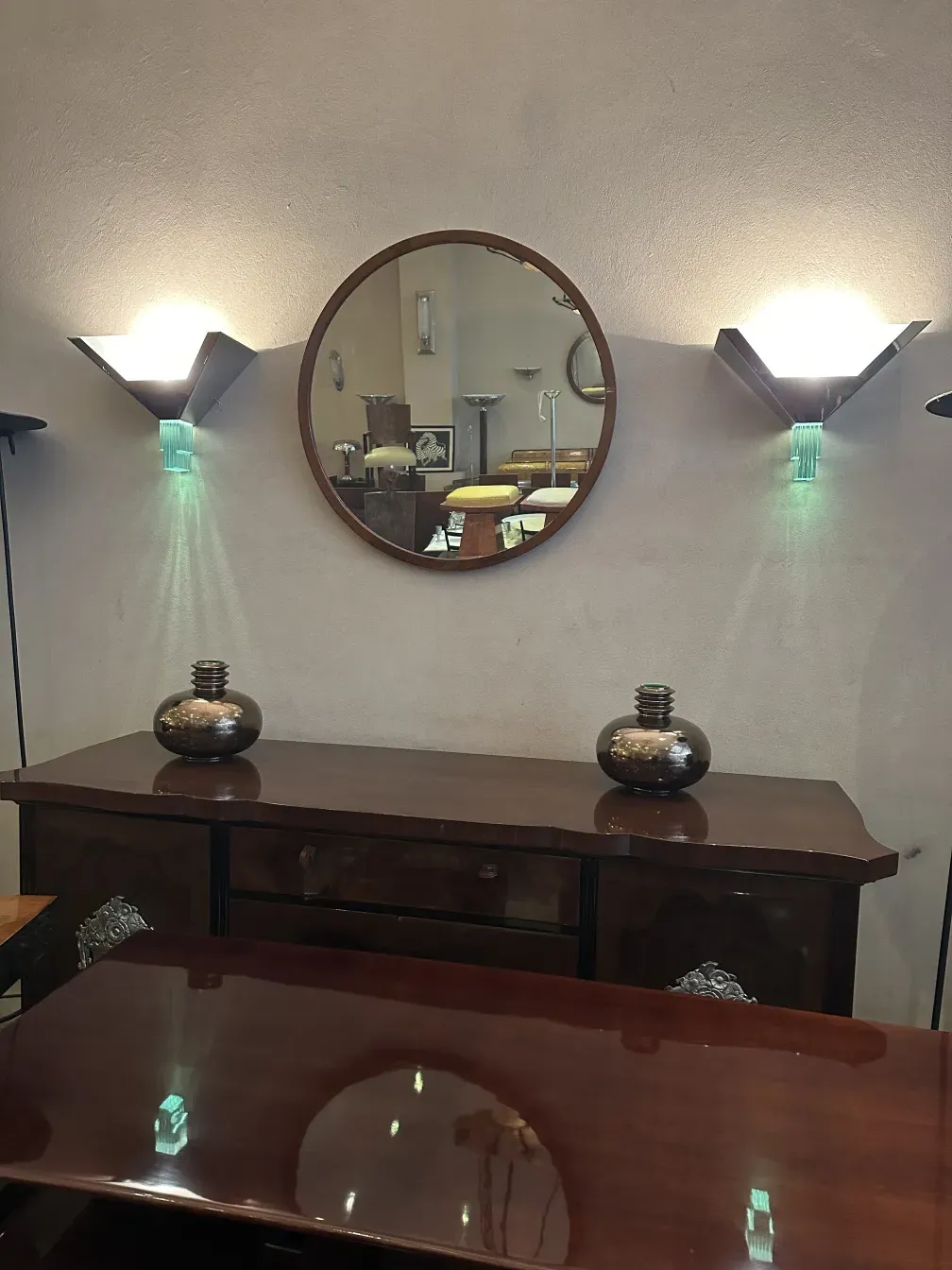 antique wall mirror with lights and wooden table