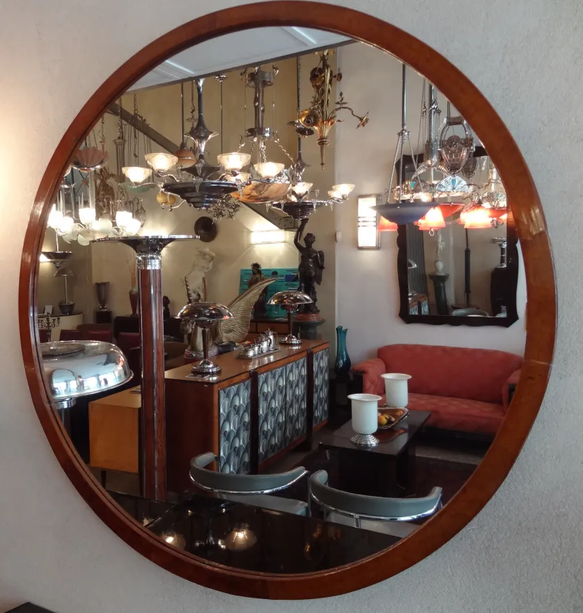 antique round mirror with decorations and elegant ambiance