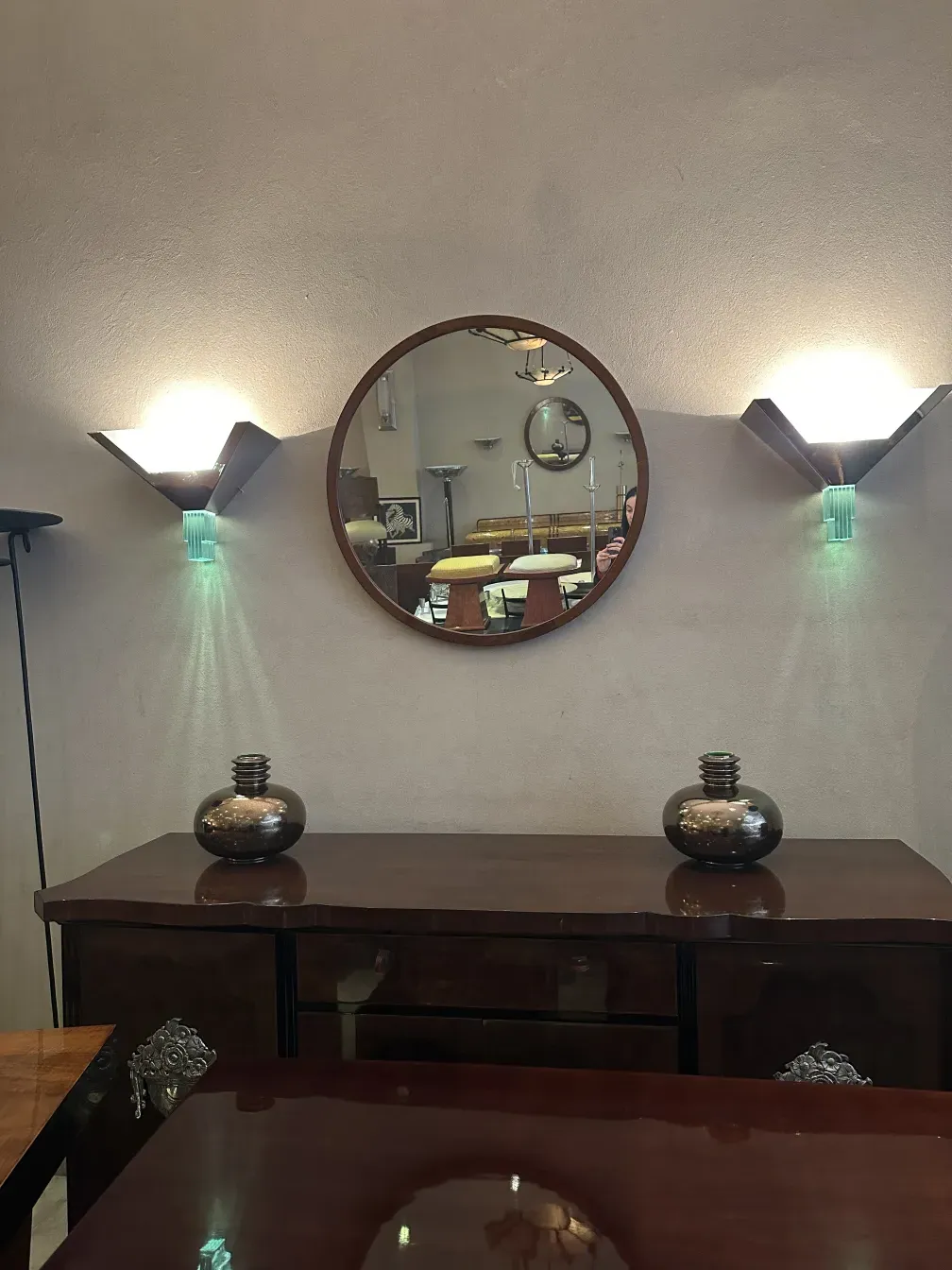 round antique mirror with classic frame, soft lighting