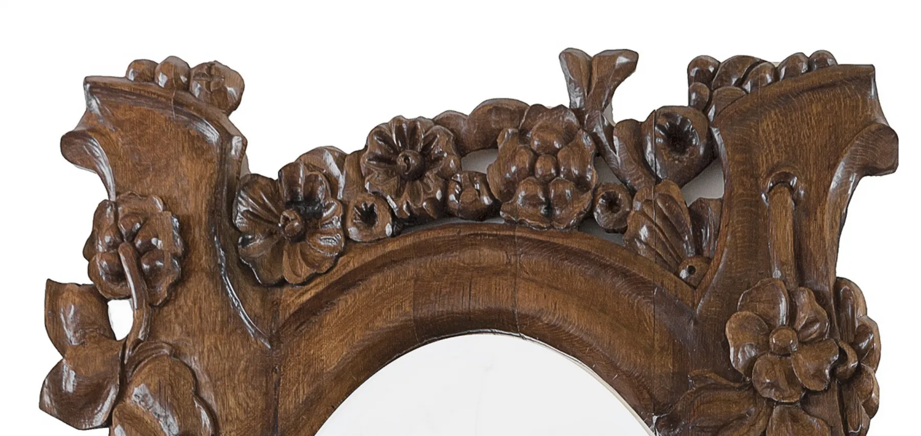 antique mirror with a floral decorated frame