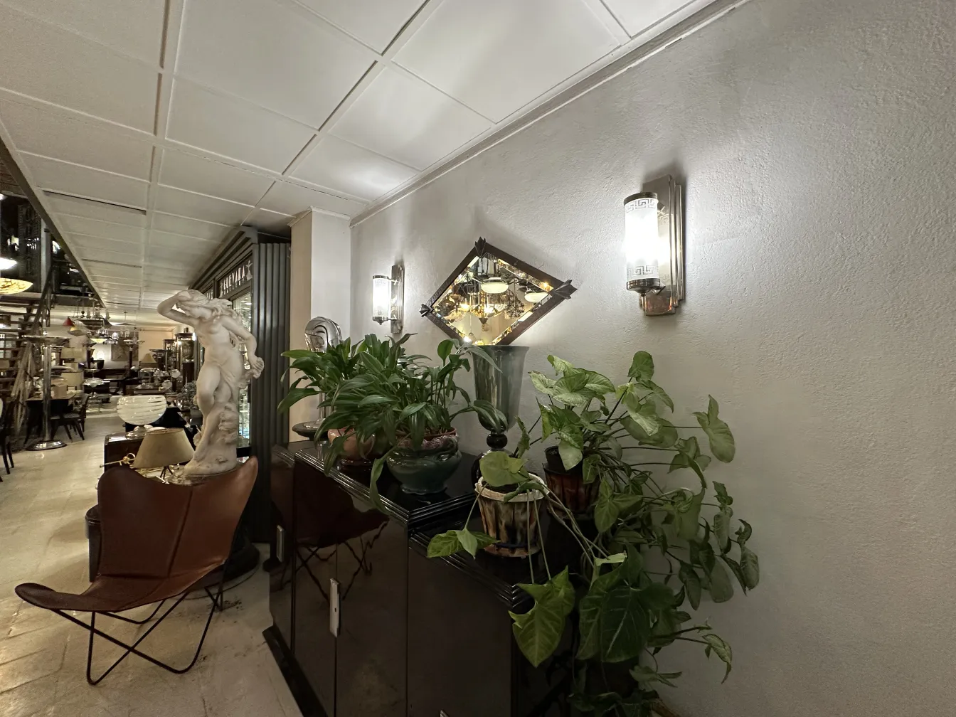 antique mirror with decorative frame on the wall