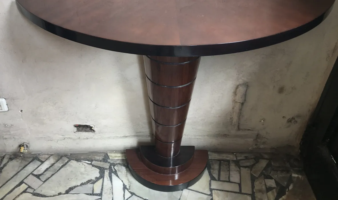 antique round console with elegant base