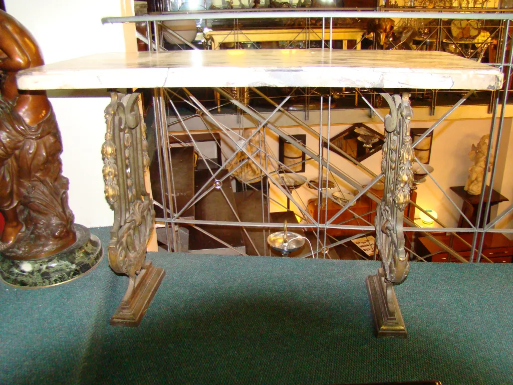 side view of an antique console with decor