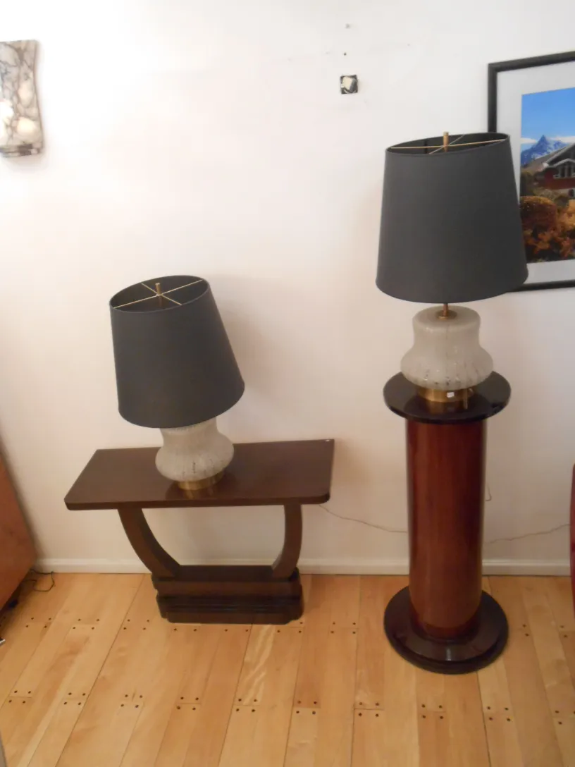 Antique console with lamp and attractive design.