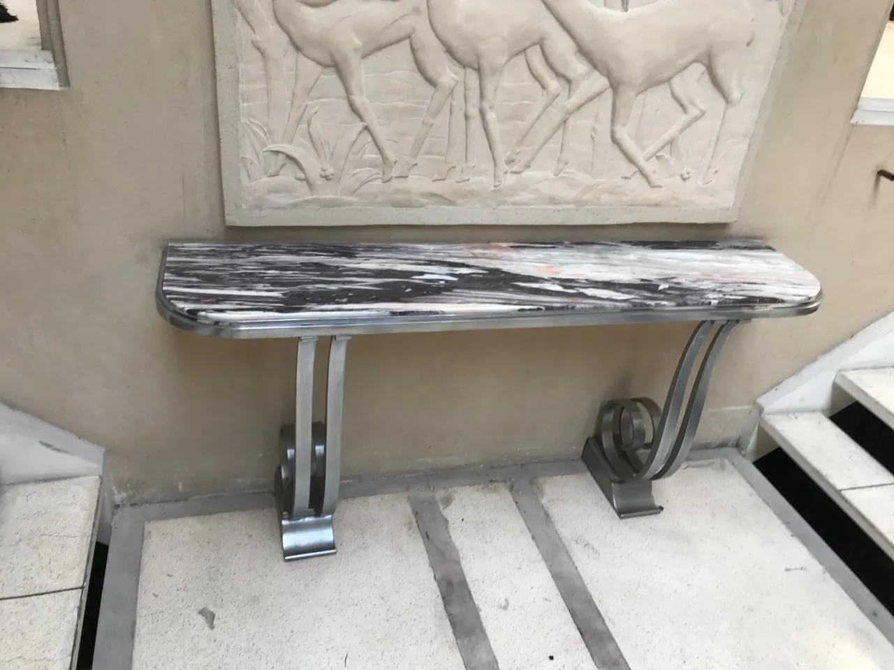Elegant antique console with decorative background walls