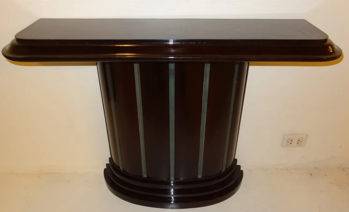 elegant antique console table against a plain background