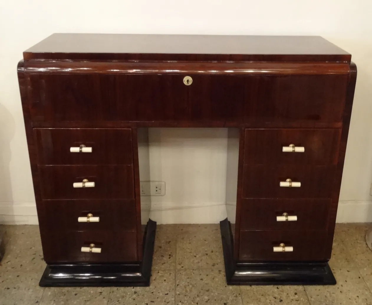 Antique console with compartments and drawers.
