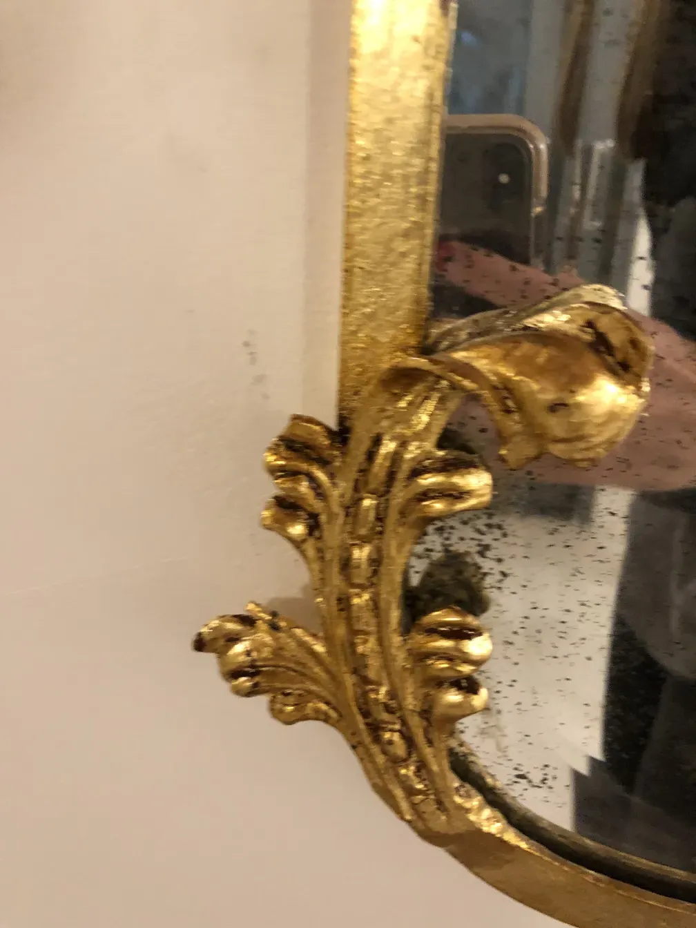 antique console with gold details and mirror