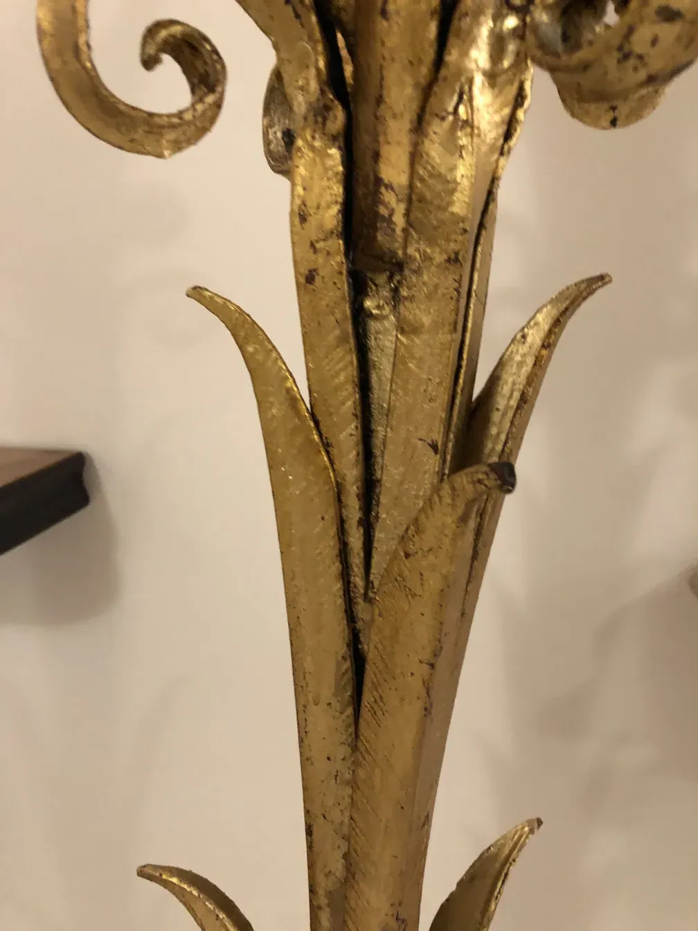 Close view of an antique decorative console with golden details.