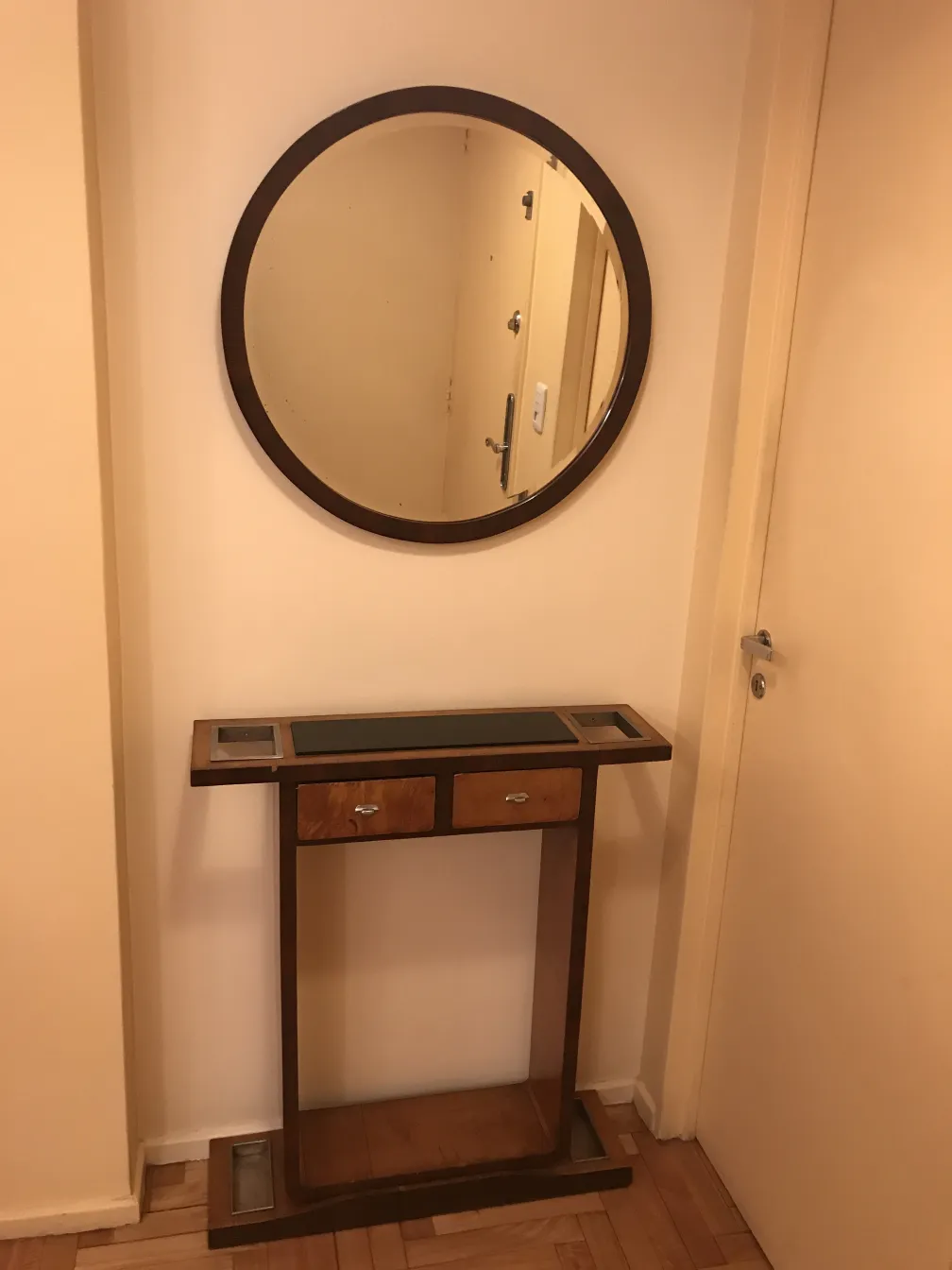 antique console with two drawers and round mirror