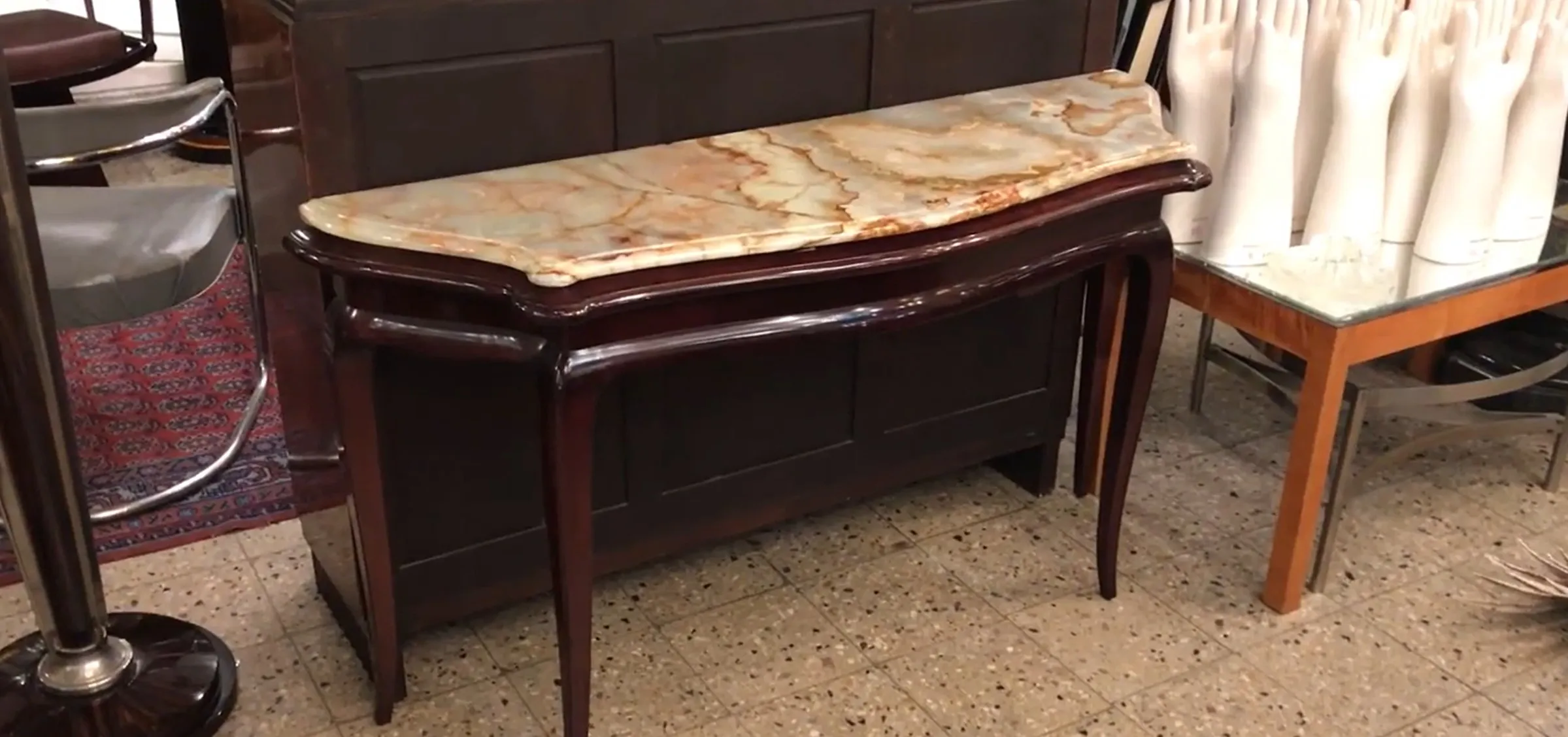 antique console with decorative top in classic setting