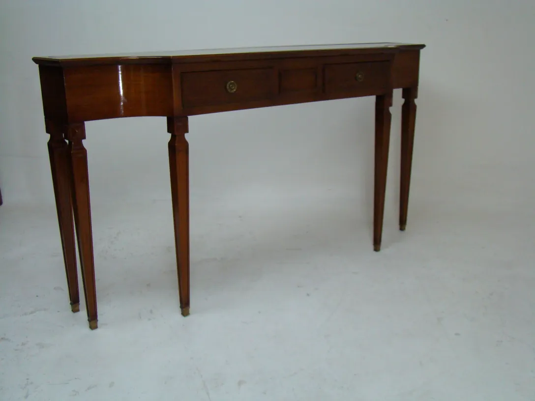antique console table featuring elegant design with slender legs