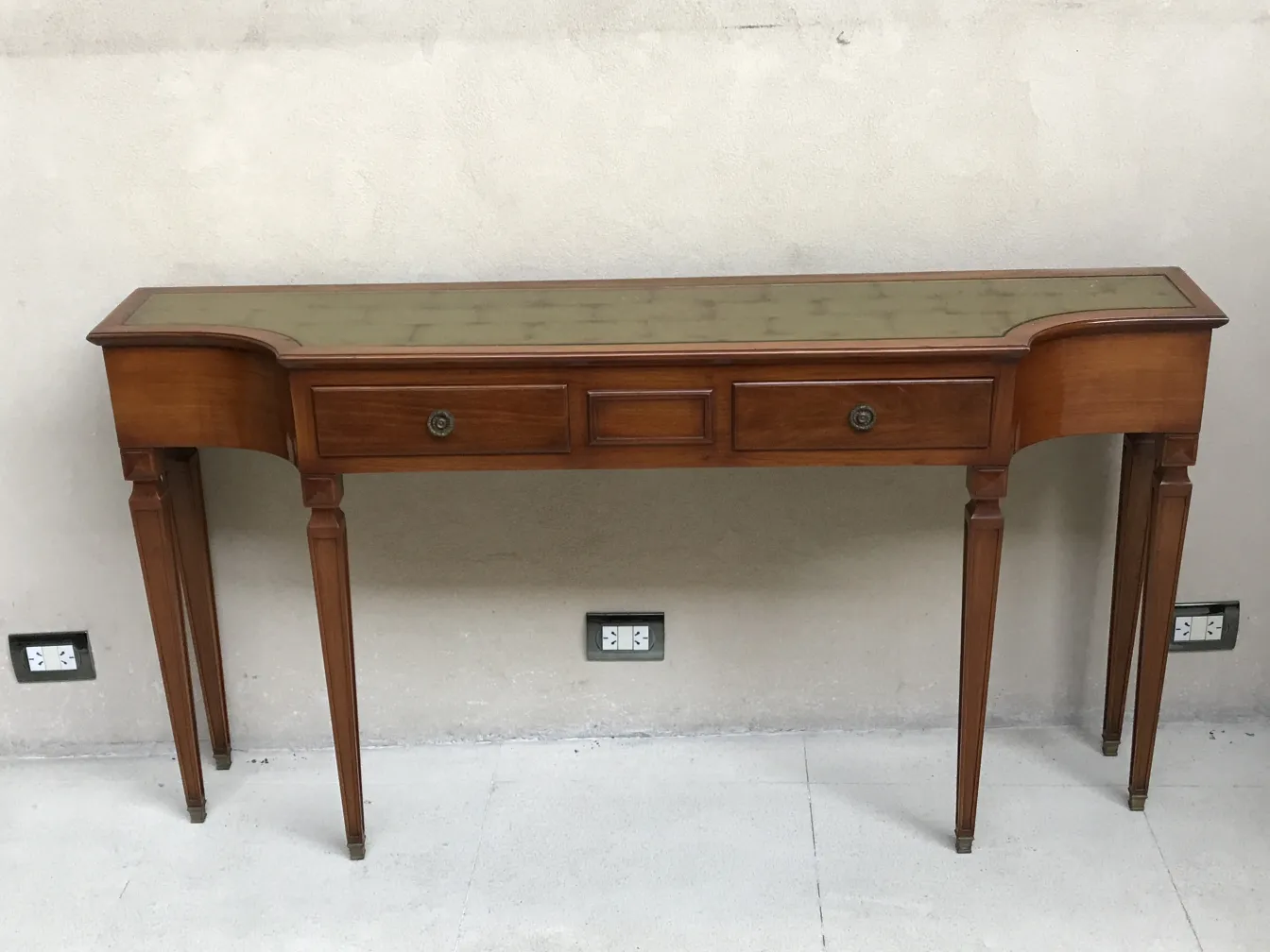 antique console with elegant details and two drawers