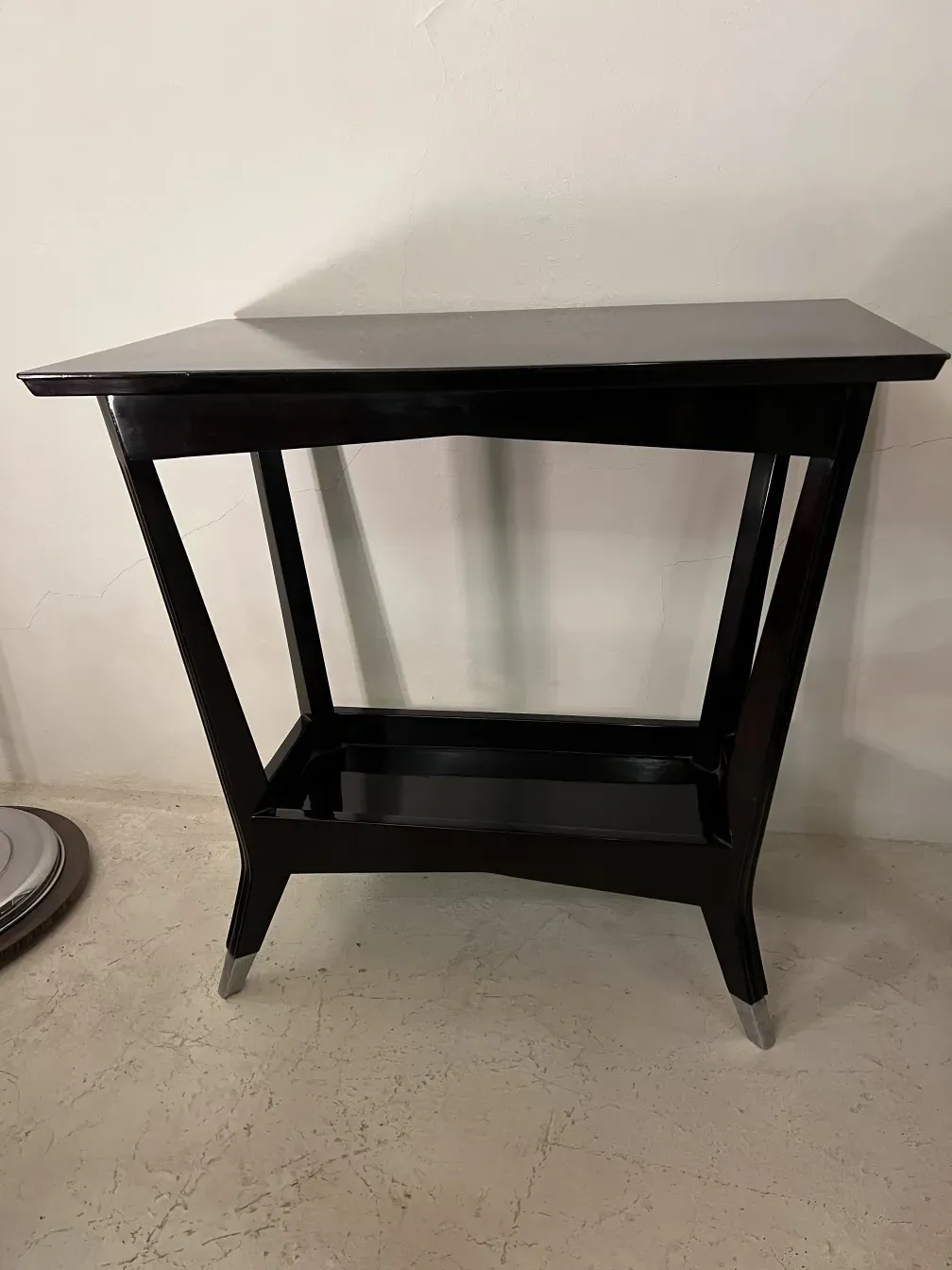 antique decorative console with a sleek design, set against a neutral background