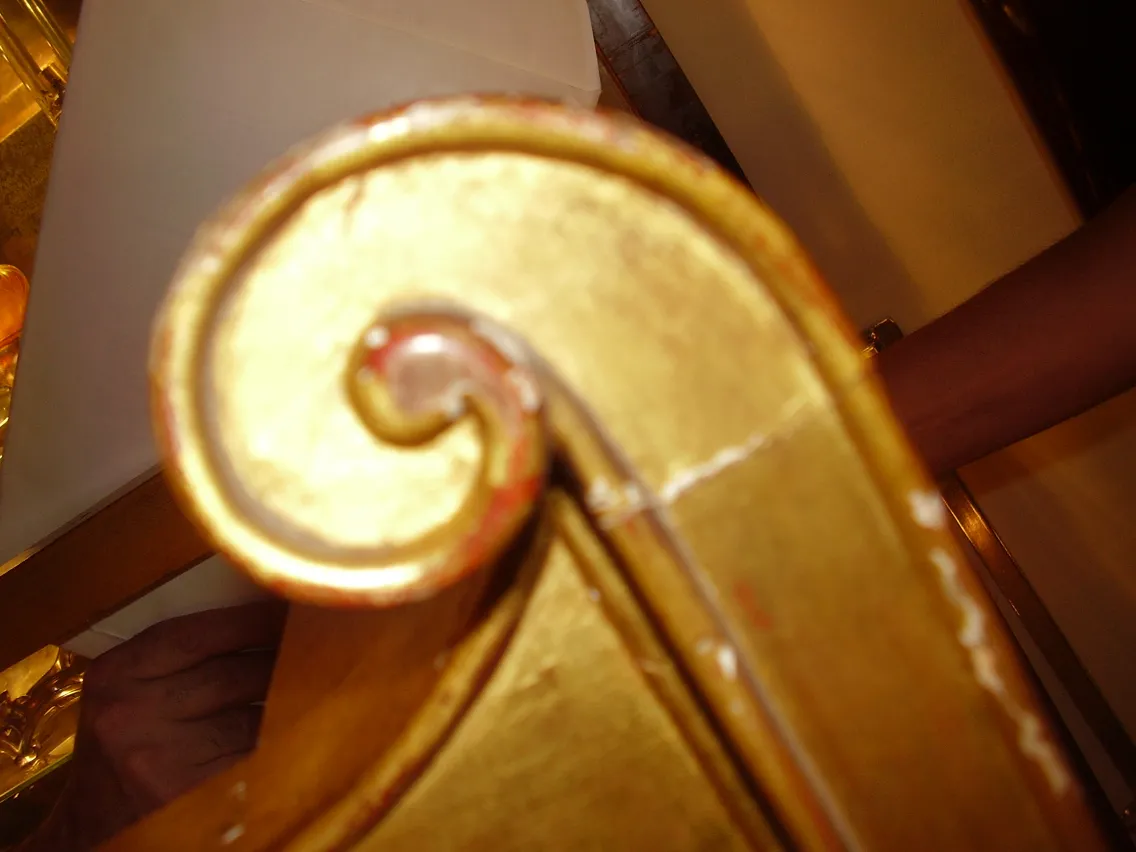 Close-up view of an antique console with ornamental details.