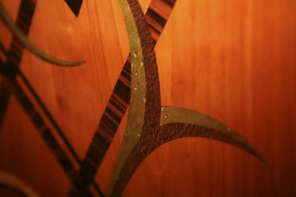 detail of antique console with artistic design on light background