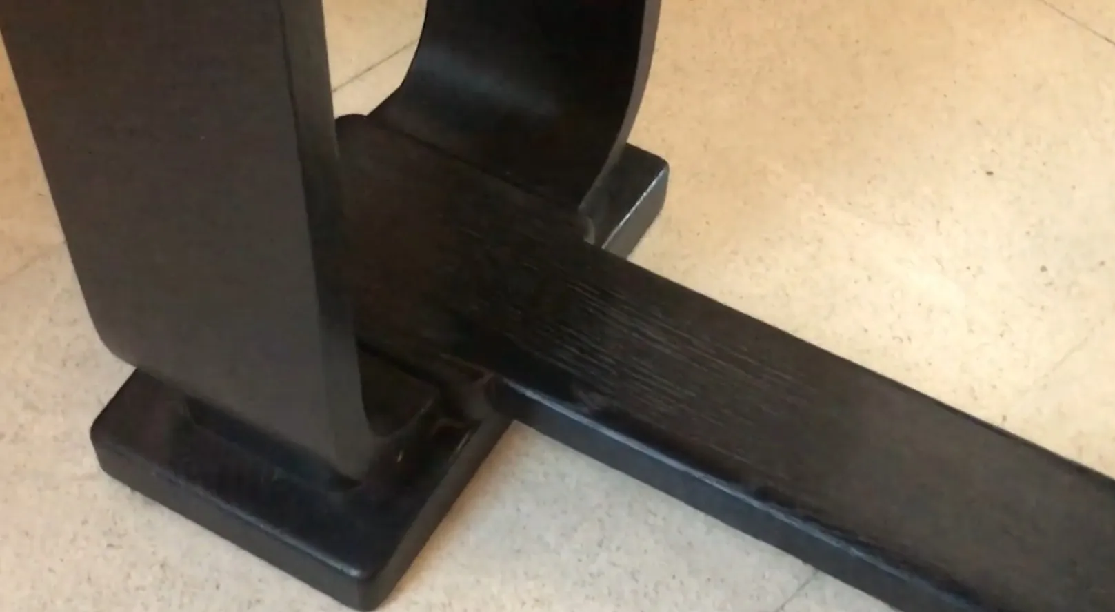 view of the base of an antique console with elegant lines